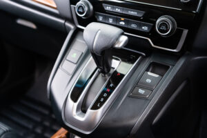 automatic transmission shift selector in the car interior. Closeup a manual shift of modern car gear shifter. 4x4 gear shift